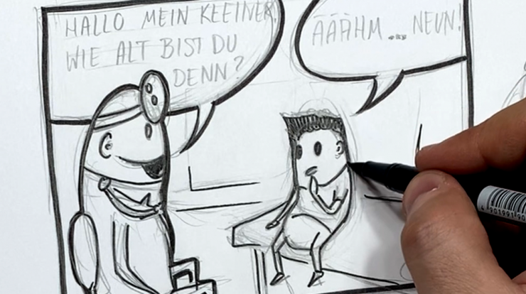 Person zeichnet einen Comic mit Bleistift